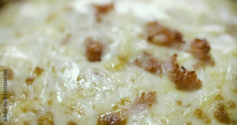 close up of a delicious cheese pizza or spaghetti close up of a delicious cheese pizza or spaghetti