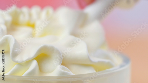 Swirls of whipped cream, macro closeup preparation for cake decorating.