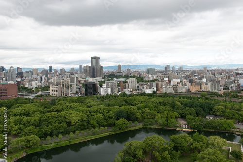 Aerial view of moat around castle park  Osaka business district and spectacular mountains surrounding the city from Osaka Castle.