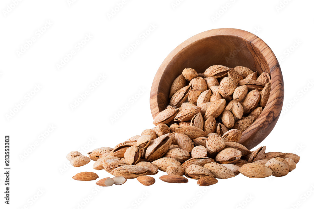 Almond nuts with shell in a wood bowl Isolated on white Almond nuts with shell in a wood bowl Isolated on white