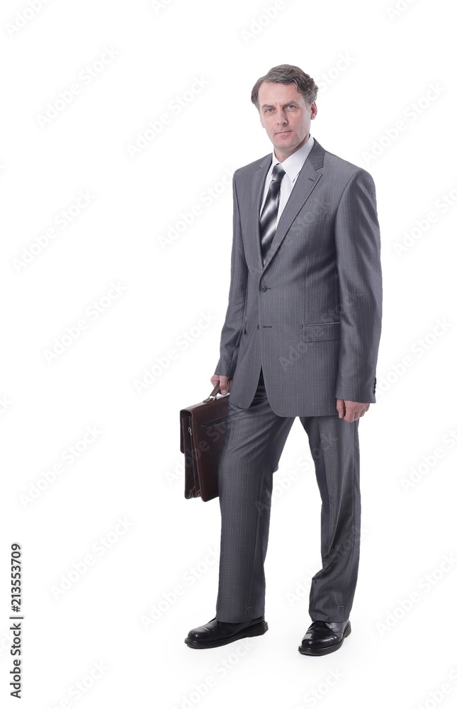 in all growth.Serious man in suit holding jacket in all growth.Serious man in suit holding jacket
