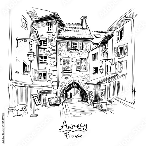 Vector black and white , city view with Gorgeous medieval arch gate Sepulchre Gate on the street Rue Sainte-Claire in Old Town of Annecy, France.
