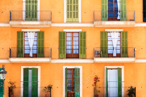 Doors and balconies on urban apartment building, Florence, Italy