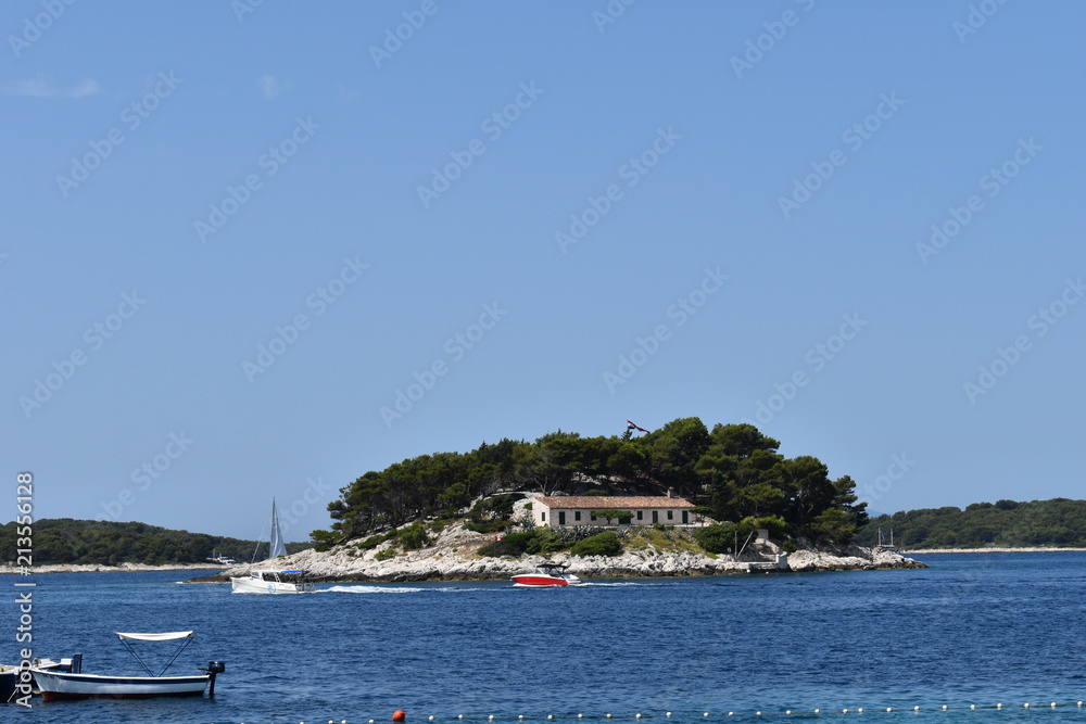 Sailboats in the Adriatic sea on the Dalmatian coast. Luxury speed boat excursions serve Pakleni islands which have secluded beaches and coves Party coastal cruise route with snorkeling from Hvar isle