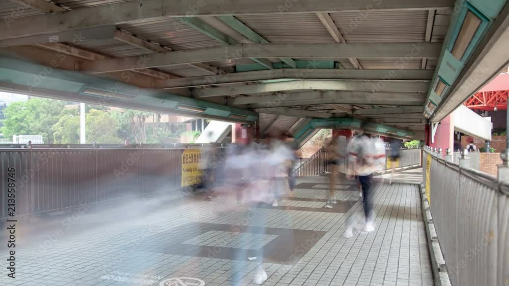 Time lapse Busy traffic of people in the overhead passage in Hong Kong