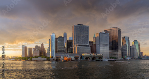 Panorama view of  NYC Lower Manhattan skyline with sailboat passing by in New York Harbor © eileen10