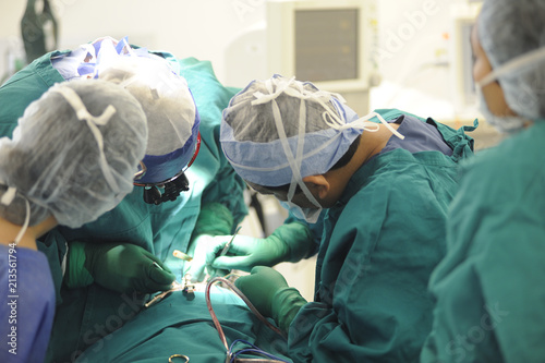 Concentrating surgeons performing operation
