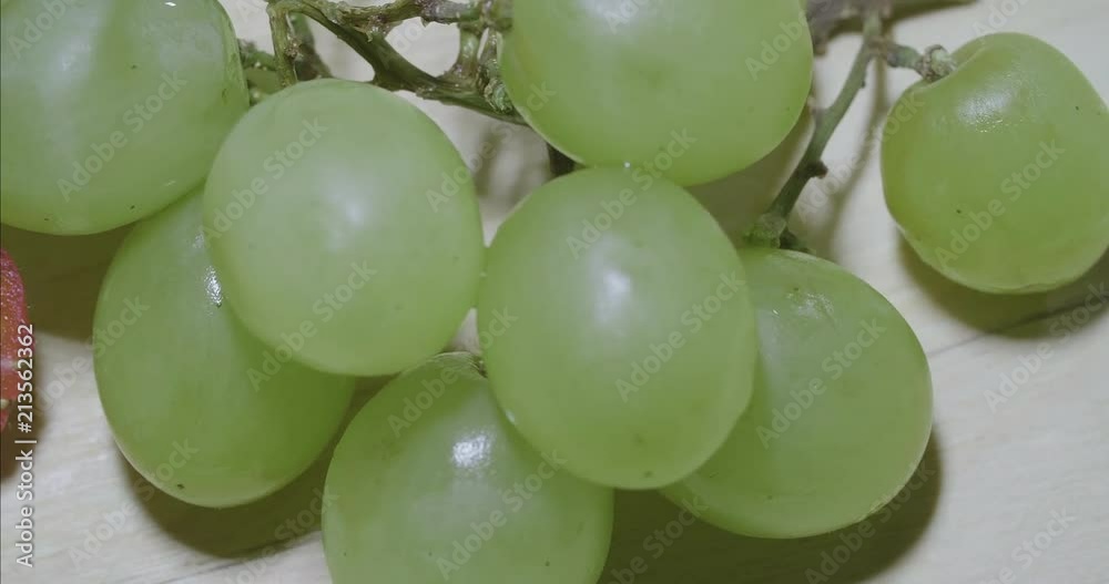 close up panoramic view of fruits like strawberries and grapes on a piece of wood after being cut close up panoramic view of fruits like strawberries and grapes on a piece of wood after being cut