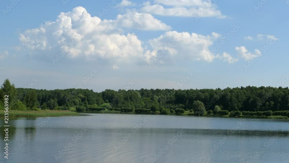 Summer Landscape A Lake With Green Trees And Clouds On Blue Sky Summer Landscape A Lake With Green Trees And Clouds On Blue Sky