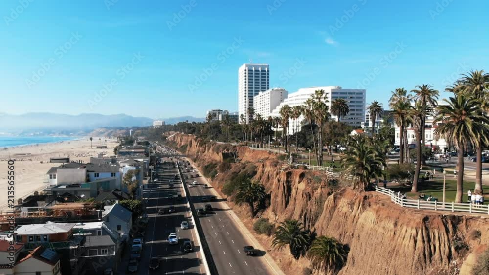 Santa Monica Drone in Los Angeles, CA with beautiful sunshine during summer next to The Pier on the Beachfront