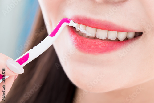 woman take interdental brush