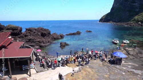 Panorama over jeju diving woman and spectators viewing photo