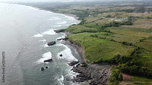 Secondary angle of Aerial coastal footage of Bali coastline photo