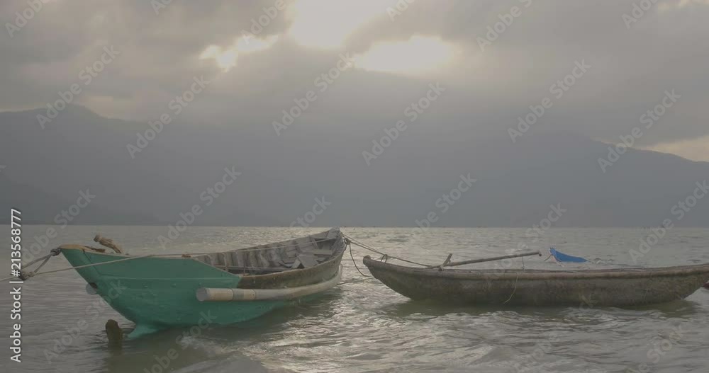two banana boat swaying in the water on a river in Vietnam. two banana boat swaying in the water on a river in Vietnam.