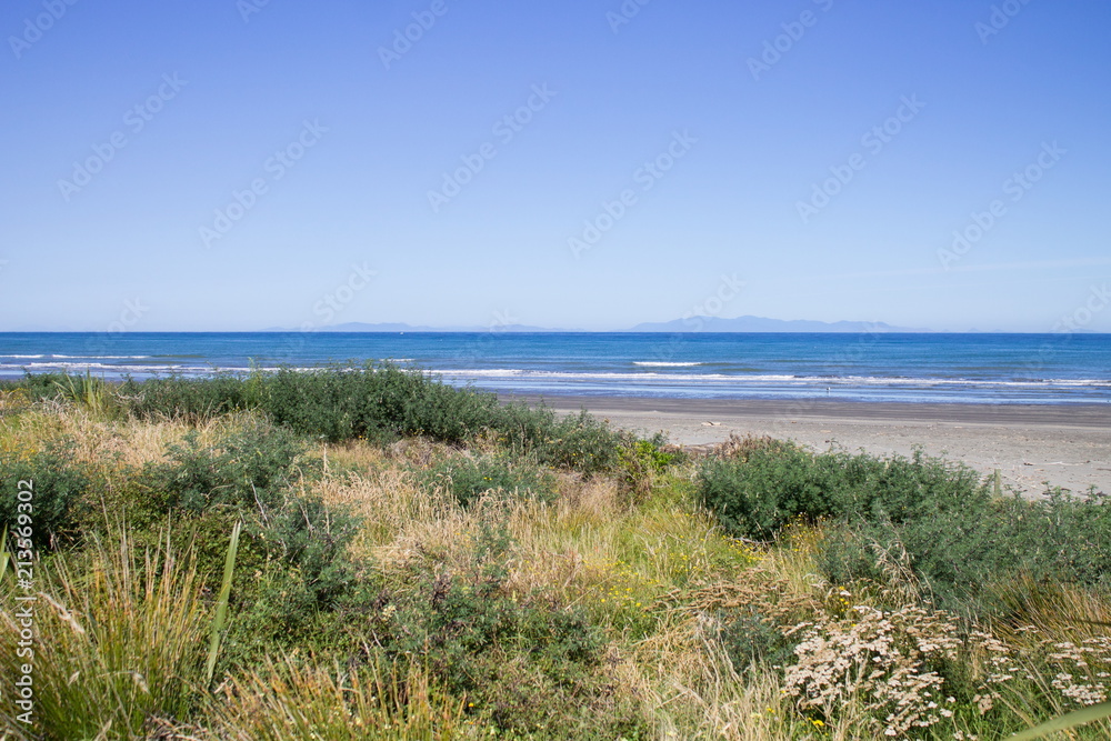 Landscape view from Paraparaumu Beach in Kapiti, Wellington, looking out across the Tasman Sea to the South Island of New Zealand. Landscape view from Paraparaumu Beach in Kapiti, Wellington, looking out across the Tasman Sea to the South Island of New Zealand.