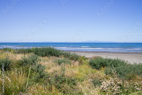 Landscape view from Paraparaumu Beach in Kapiti, Wellington, looking out across the Tasman Sea to the South Island of New Zealand.