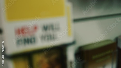 Wallpaper Mural Camera panning around a brochure that says help will find you Torontodigital.ca