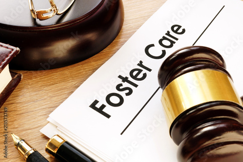Foster care. Documents and gavel on a desk.
