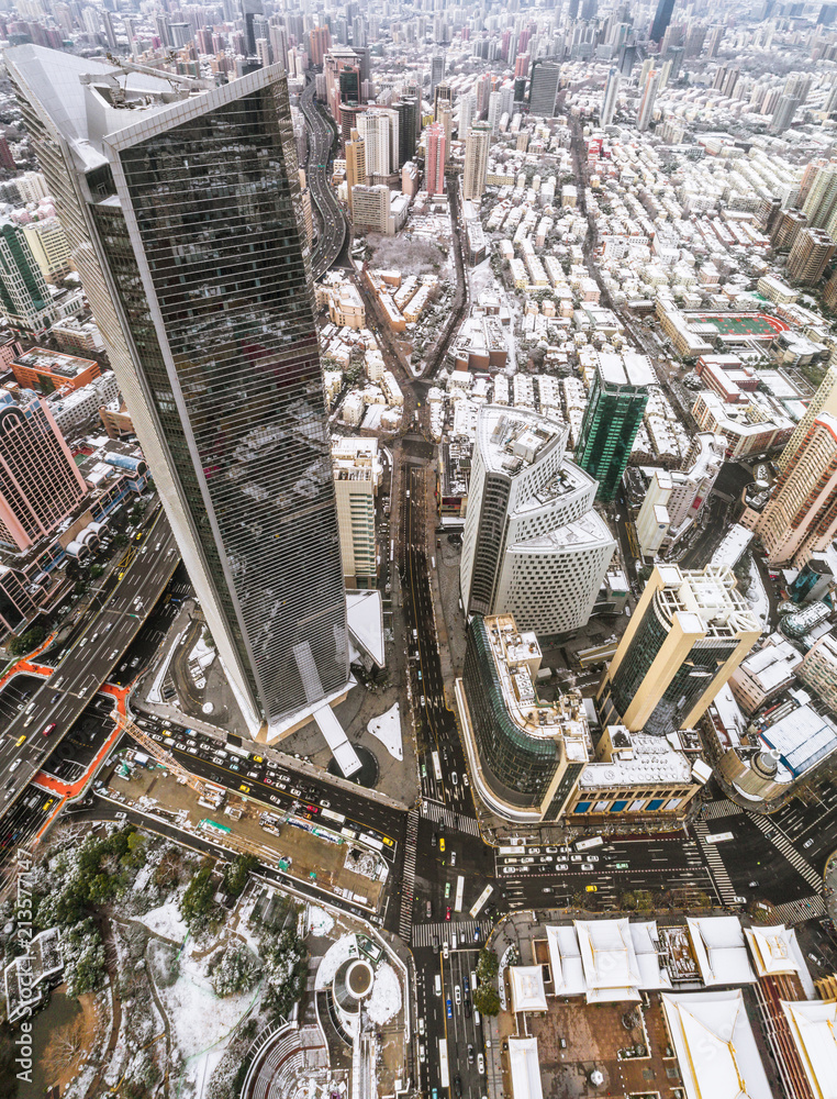 Fototapeta premium aerial view of downtown Shanghai near Jing An Temple and Nanjin Road after an unusual snowfall in the morning