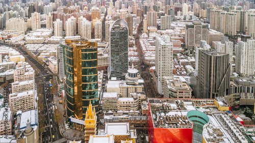 aerial view of downtown Shanghai near Jing An Temple and Nanjin Road after an unusual snowfall in the morning photo