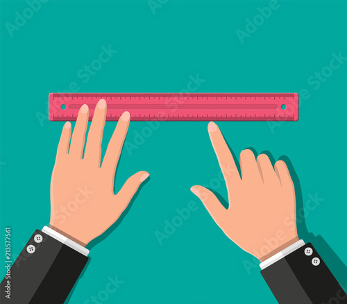 Plastic measuring ruler in hand.