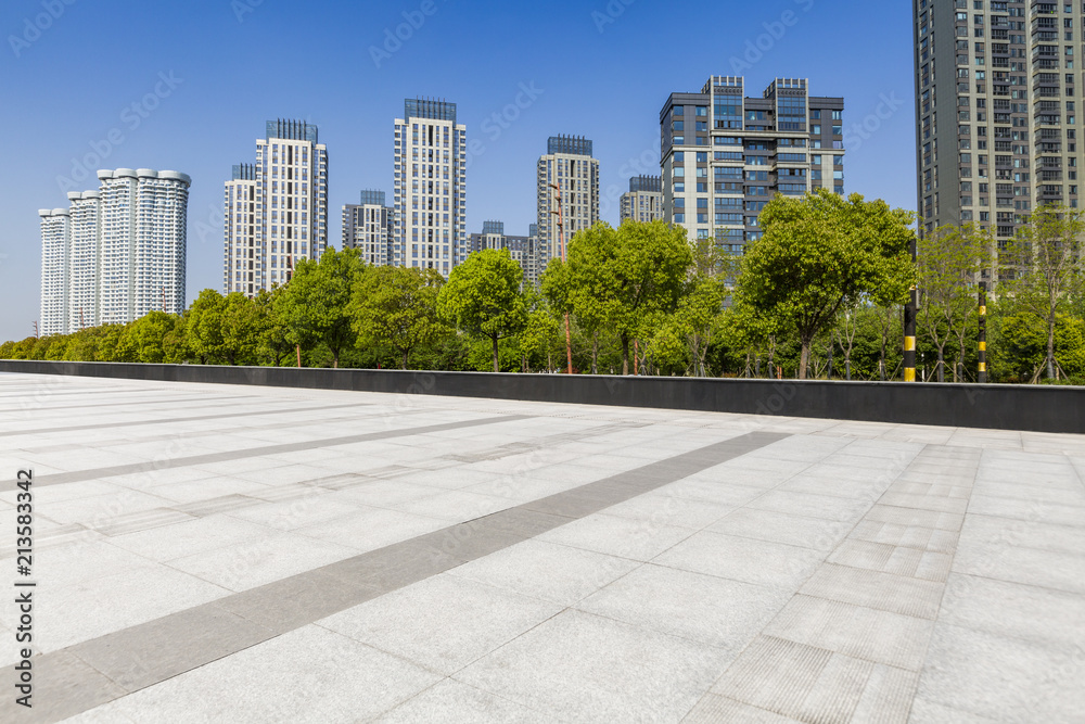 Panoramic skyline and modern business office buildings with empty road,empty concrete square floor