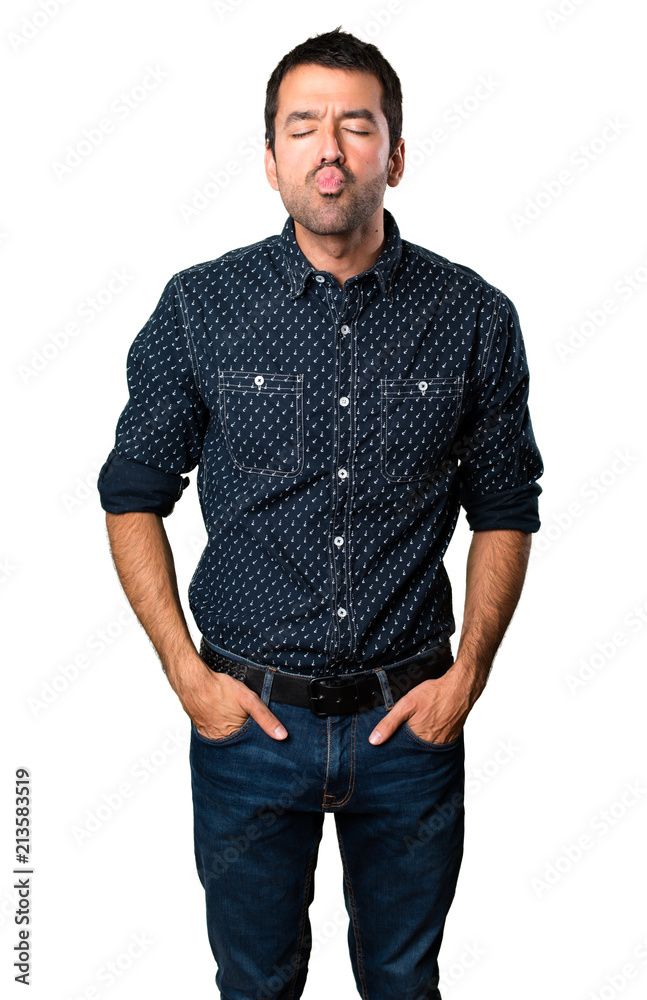 Brunette man sending a kiss on isolated white background Brunette man sending a kiss on isolated white background