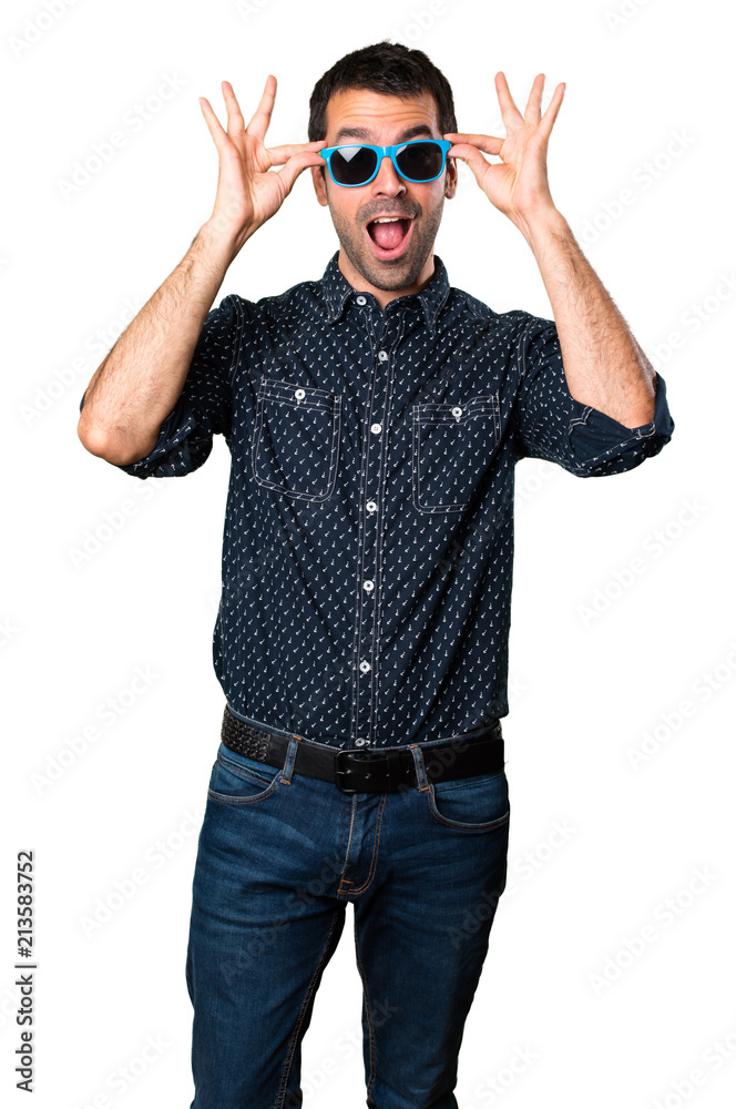 Surprised Brunette man with sunglasses on isolated white background Surprised Brunette man with sunglasses on isolated white background