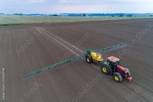 Tractor spraying the pesticides on the field