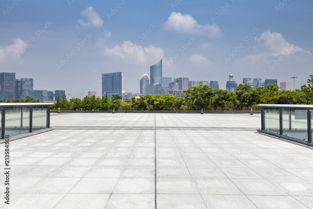 Fototapeta premium Panoramic skyline and modern business office buildings with empty road,empty concrete square floor