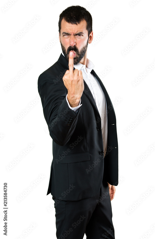 Fototapeta premium Handsome businessman making horn gesture