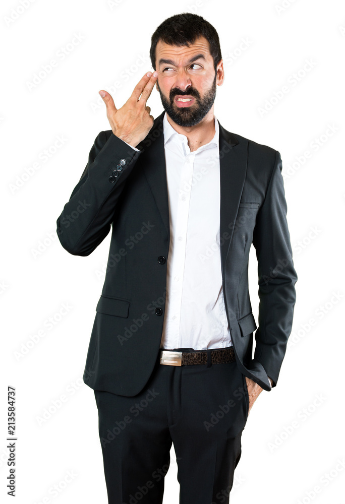 Handsome businessman making suicide gesture Handsome businessman making suicide gesture