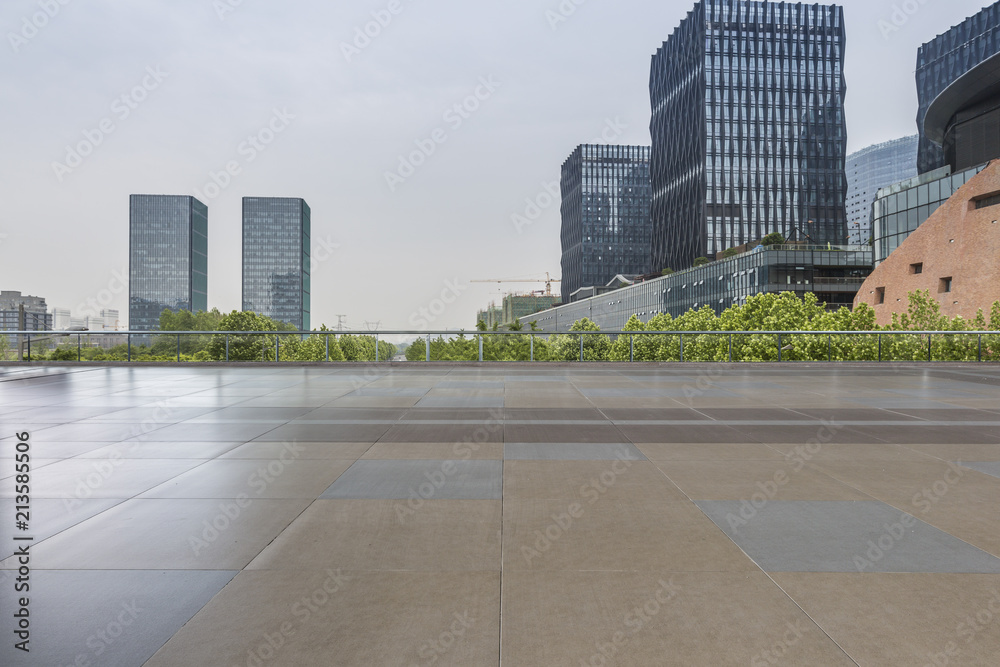 Panoramic skyline and modern business office buildings with empty road,empty concrete square floor