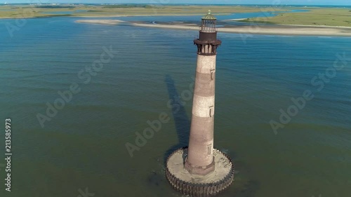 Aerial drone shots of Morris Island Lighthouse at Folly Beach Charleston, South Carolina and the surrounding area. photo