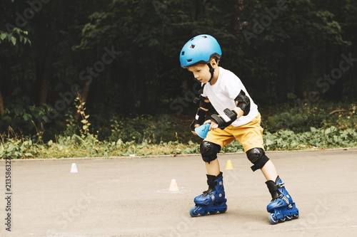 Boy riding on roller skates at outdoor park