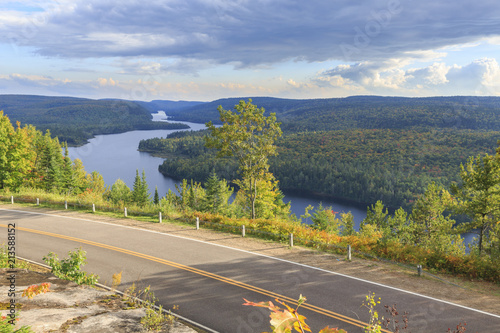 Road through La Mauricie National Park with Lake Wapizagonke in the back, Québec, Canada