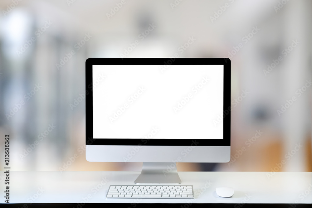 Mock up computer on white table in modern office blur. Mock up computer on white table in modern office blur.