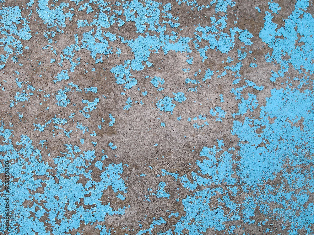 Obraz premium Old peeling blue paint on the concrete wall. Grunge stucco background