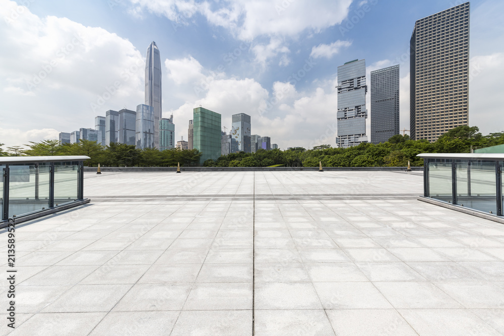 Panoramic skyline and modern business office buildings with empty road,empty concrete square floor