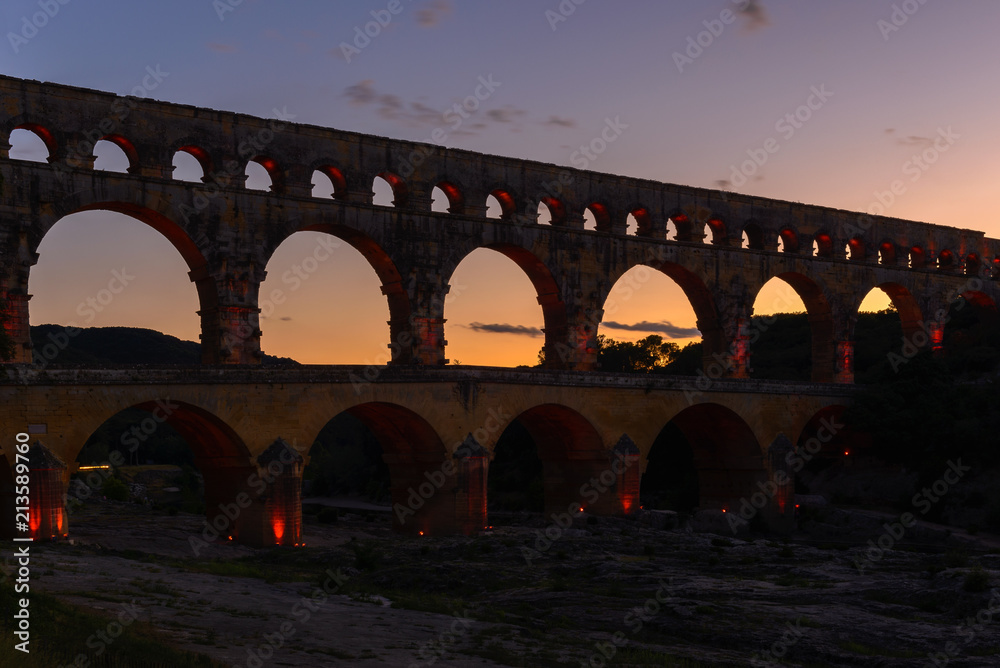 Roman aqueduct of Pont du Gard at dusk, France