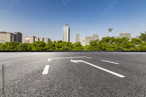 Panoramic skyline and modern business office buildings with empty road empty concrete square floor