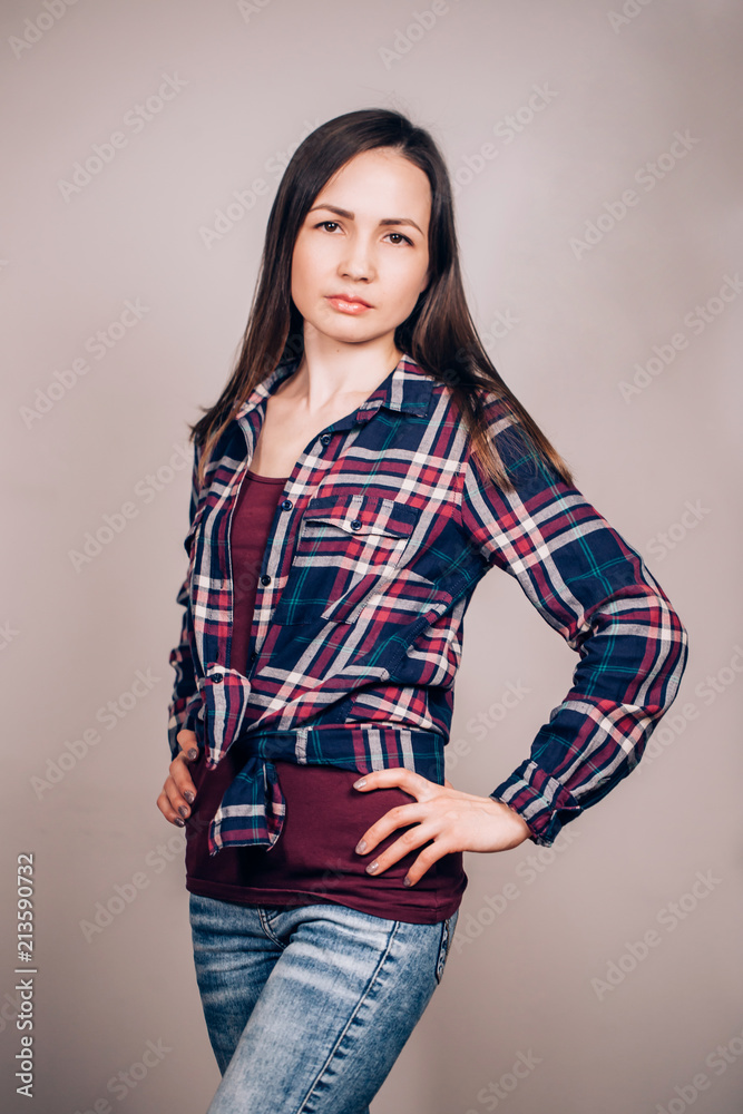 A young hipster girl on gray background A young hipster girl on gray background