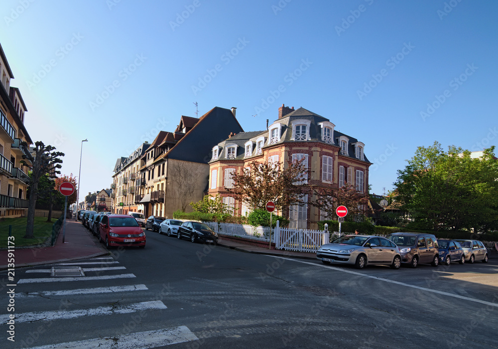 DEAUVILLE, FRANCE-MAY 05,2018: A typical street corner in the city of Deauville, Calvados department of Normandy, France. Beautiful spring morning landscape