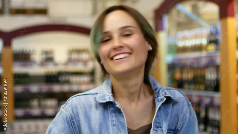 Attractive young woman look ar camera smiling feel happy in mall Attractive young woman look ar camera smiling feel happy in mall