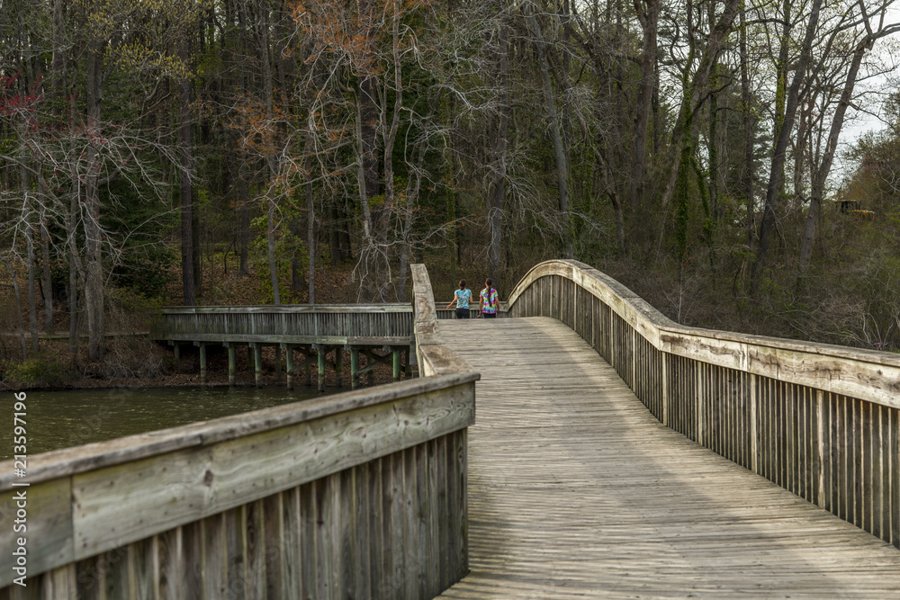 Jogging on a wooden bridge path