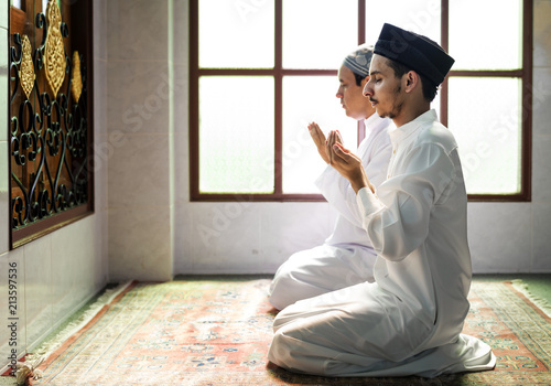 Muslim men making Dua to Allah photo