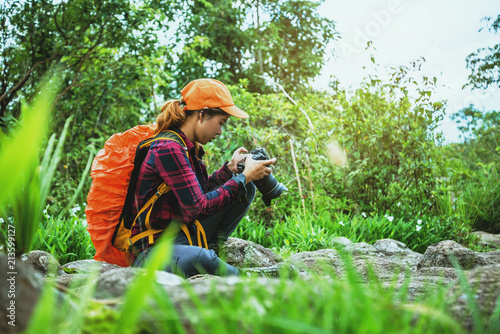 Woman asian travel nature. Travel relax. Walk study the path Nature in the forest photo