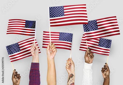 Hands waving flags of the United States