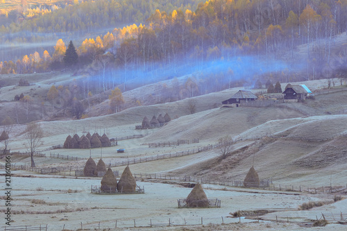 mountain landscape with autumn morning fog at sunrise - Fundatura Ponorului, Romania photo