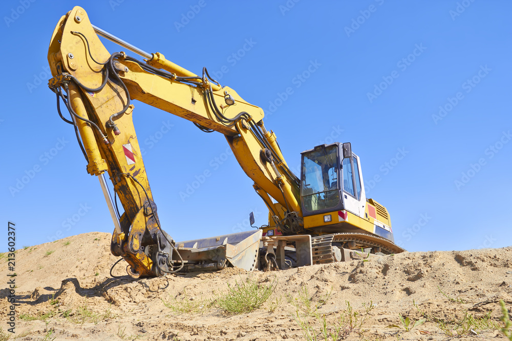 Excavator in construction site Excavator in construction site